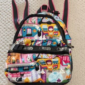 Lesportsac Colorful Town Print Backpack ( As Is)in Pink, Blue, Yellow